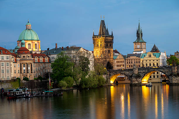 istock View across river to old town and bridge at dusk, Prague 2214462261
