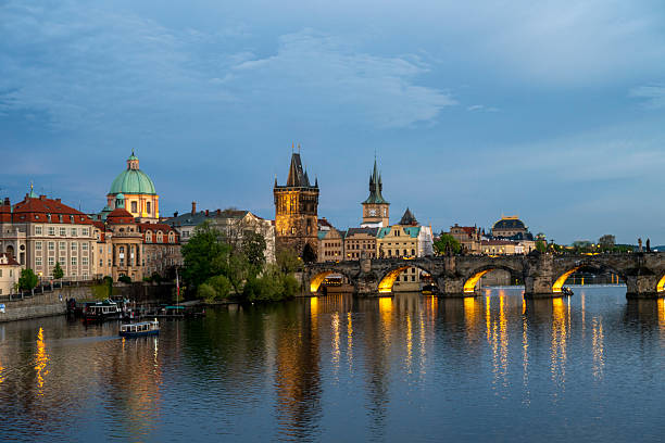 istock View across river to old town and bridge at dusk, Prague 2214462580