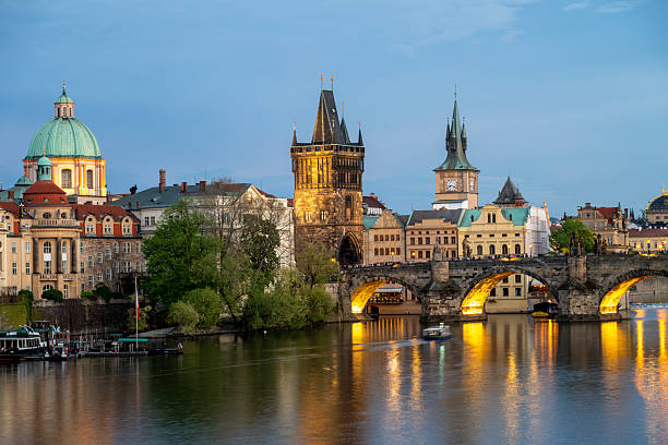 istock View across river to old town and bridge at dusk, Prague 2214462581