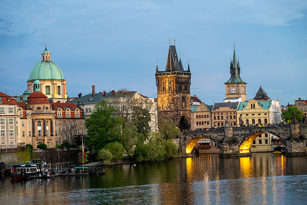 istock View across river to old town and bridge at dusk, Prague 2214462734