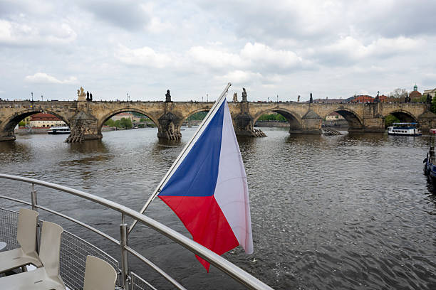View past flag on boat to old town, Prague