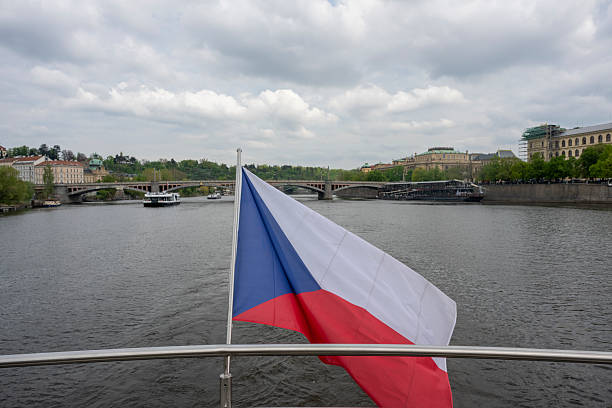 View past flag on boat to old town, Prague