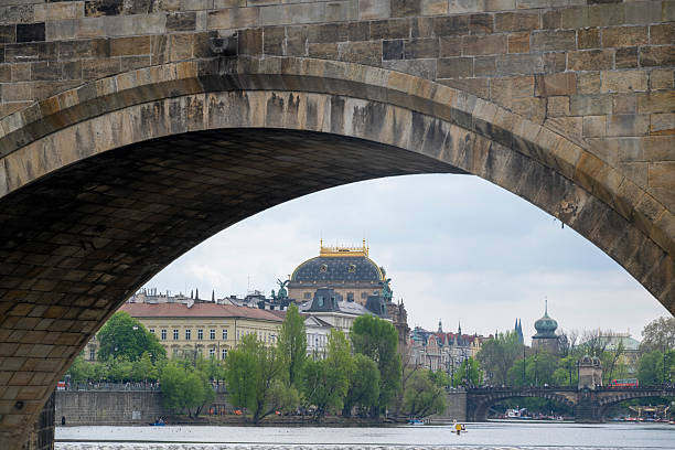 View through bridge archway to old town, Prague
