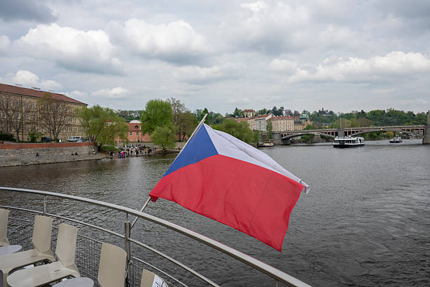 View past flag on boat to old town, Prague