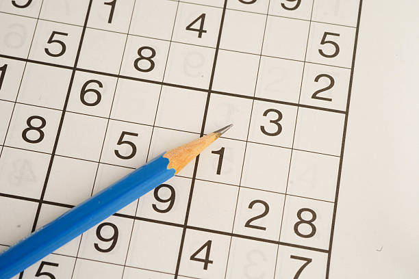 istock Sudoku puzzle, game to play for keep you brain younger for developing Alzheimer disease in senior patient. 2214464583