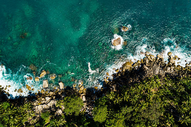 istock Aerial view Top down seashore, Waves crashing on rocks cliff, Beautiful sea surface in sunny day summer background, Amazing seascape top view seacoast at Phuket Thailand 2214465314