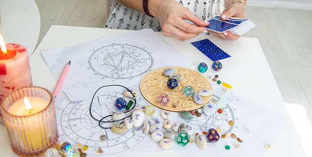istock A fortune teller reads with tarot cards. Selective focus 2214468211