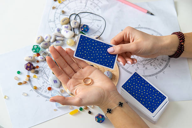 istock A fortune teller reads with tarot cards. Selective focus 2214468229