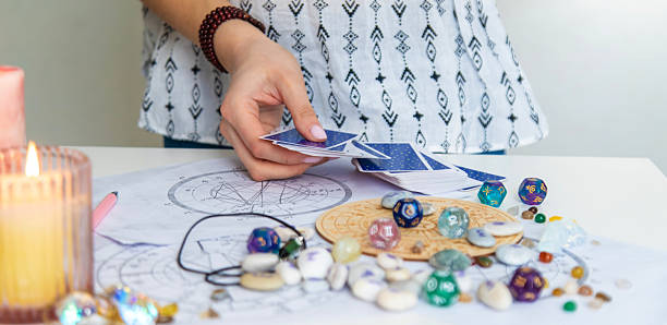 istock A fortune teller reads with tarot cards. Selective focus 2214468236
