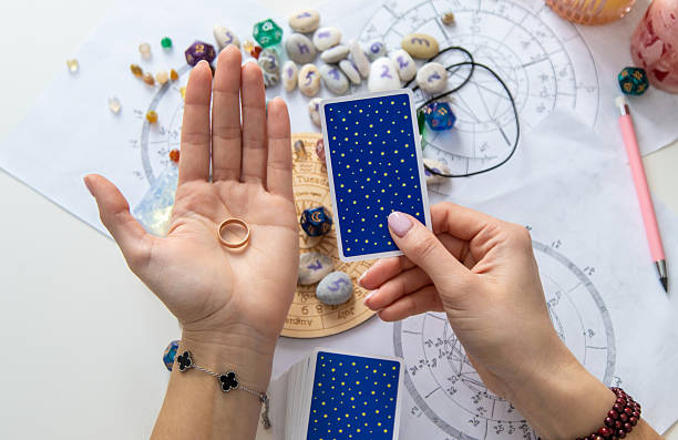 istock A fortune teller reads with tarot cards. Selective focus 2214468247