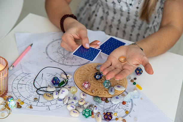 istock A fortune teller reads with tarot cards. Selective focus 2214468248
