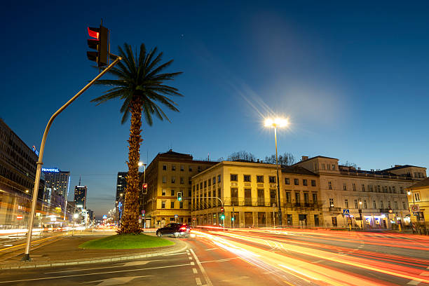 Old town at dusk with motion blur traffic, Warsaw
