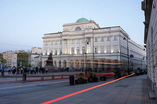 Warsaw, Poland - July 02, 2025: A historic hotel building and bustling city square in Warsaw, Poland.