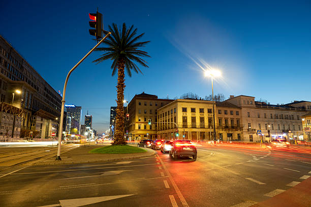 Old town at dusk with motion blur traffic, Warsaw