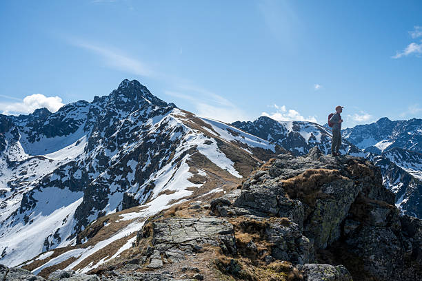 istock Hiker stands on mountain summit, Tatra National Park 2214470169