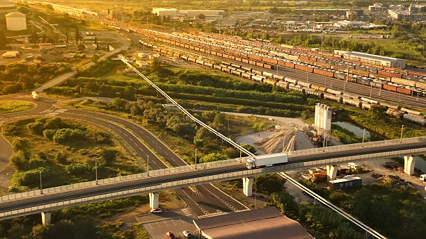 istock Highway Bridge with Trucks and Trains 2214473686