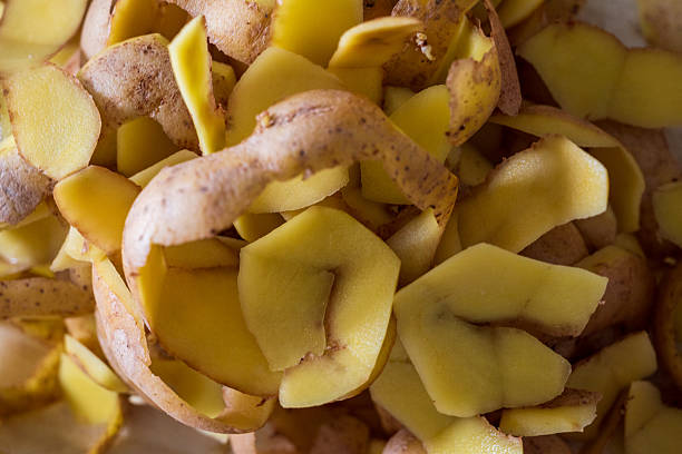 istock potato peelings or skins textured background 2214474558