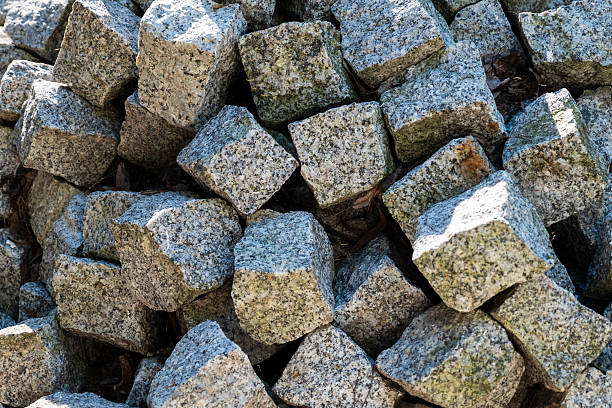 a pile of grey paving stones or cobblestones - textured background