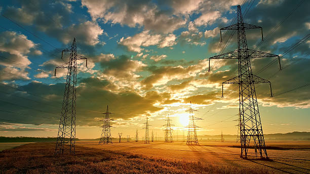istock Power lines stretch across the field, connecting the future. 2214474690