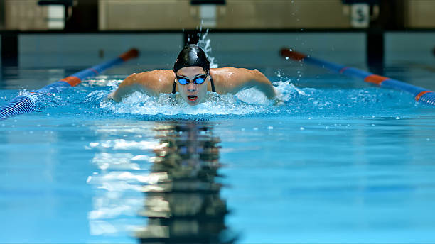 istock Swimmer in pool, training, freestyle, indoor, focused. 2214474962