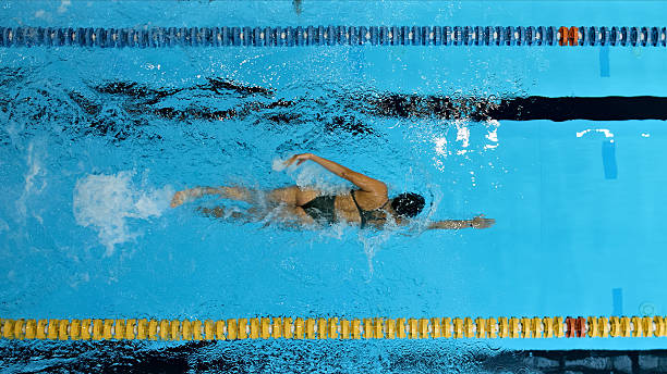 istock Swimmer glides through the pool, demonstrating freestyle technique. 2214474973