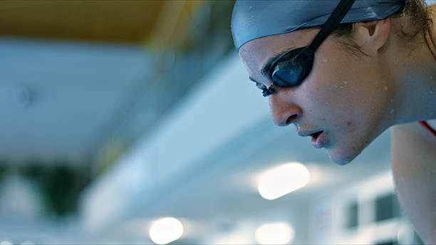 istock Swimmer in goggles and cap, focused on training. 2214474987