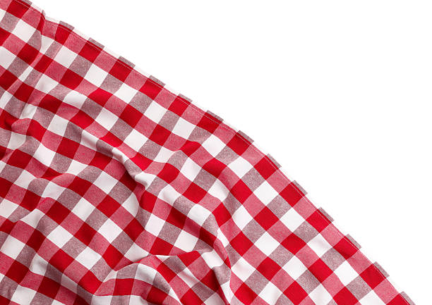 istock Crumpled checkered tablecloth isolated on white, top view 2214477599