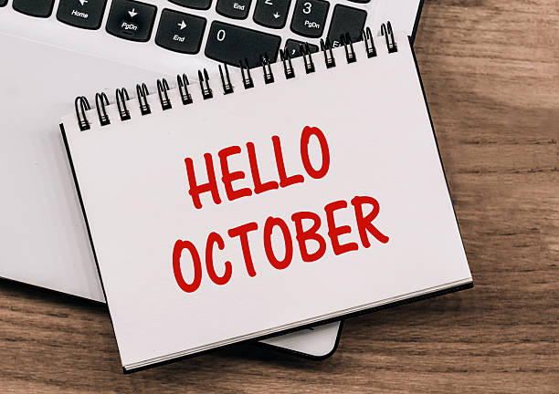 istock Hello October - inscription on notepad on laptop keyboard. 2214480297