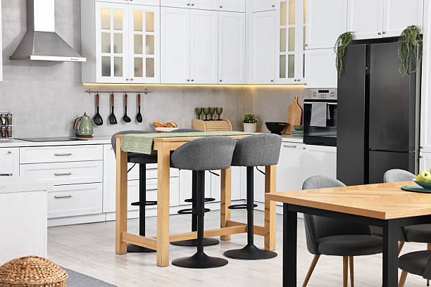 istock Bar stools near table in stylish kitchen 2214480832