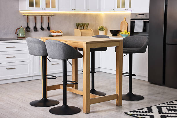 istock Bar stools near table in stylish kitchen 2214480845