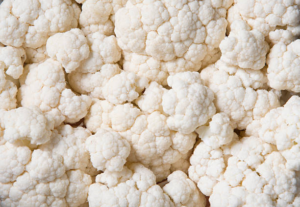 istock macro texture of cauliflower inflorescences, fresh raw vegetables spread across frame, natural white plant background, healthy eating and vegetarianism conceptealthy eating and vegetarianism concept 2214487535