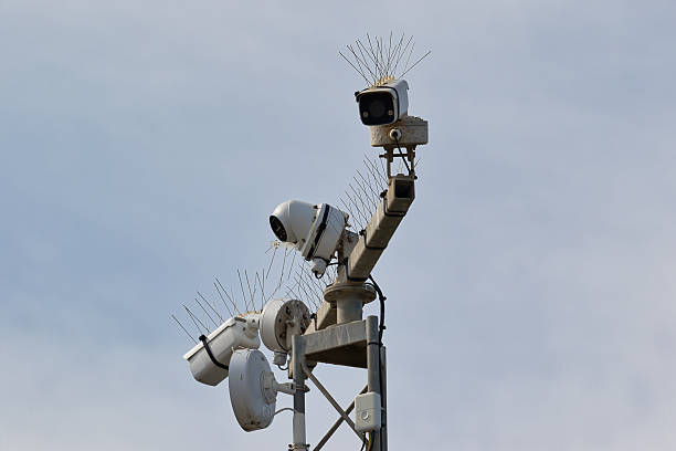 istock Surveillance Cameras on Metal Pole with Bird Deterrent Spikes 2214488251