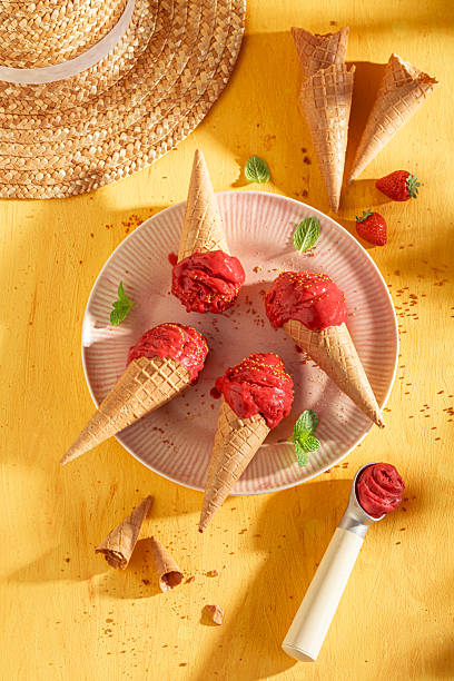 istock Sweet and cold strawberry ice cream in a waffle cone. 2214492921