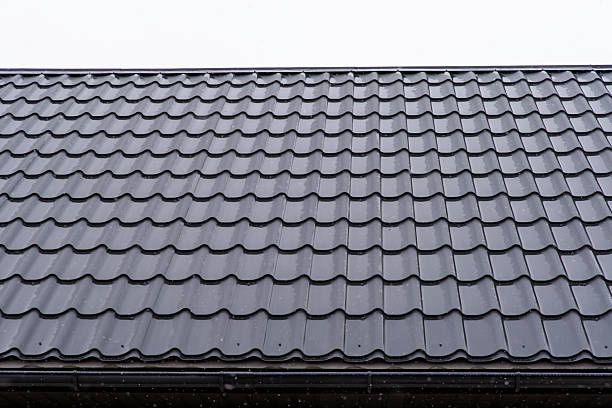 istock Shiny metal roofing sheet with scattered raindrops 2214495057