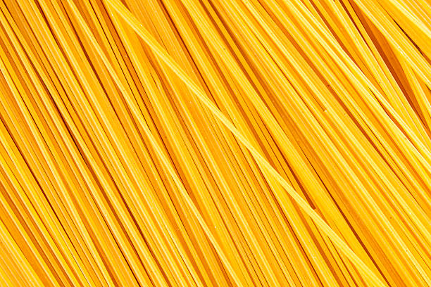 Spaghetti pasta raw durum wheat ingredient fresh dish on the table rustic food top view copy space food background