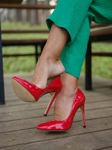 istock women's feet in red stiletto heels 2214497148