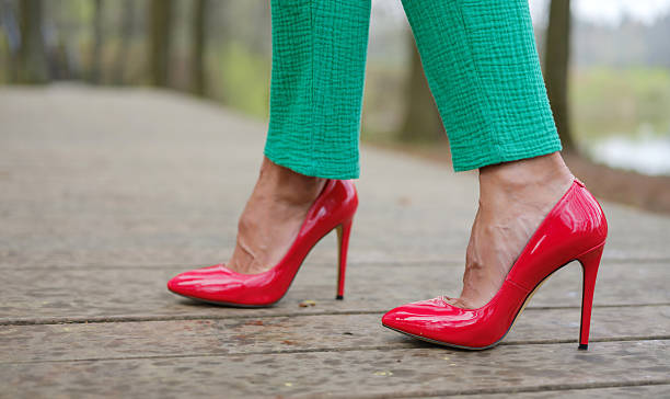istock women's feet in red stiletto heels 2214497149
