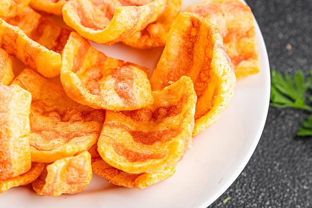 istock Chips bacon crispy rashers corn snacks fast food natural food fresh dish on the table rustic food top view copy space 2214497448