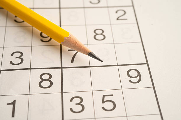 istock Sudoku puzzle, game to play for keep you brain younger for developing Alzheimer disease in senior patient. 2214497487