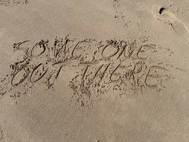 istock in a sand  strand the words someone out there are written 2214501233