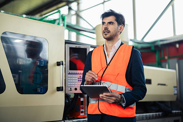 istock Engineer supervising the production at the PVC manufacturing site 2214502465