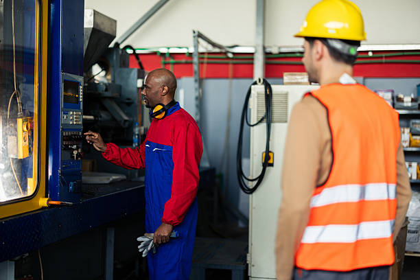 istock Workers at the PVC plant cooperating while staying at their posts 2214502486