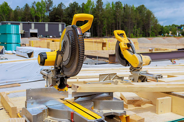 istock Construction site features electric saws wood materials with lumber stacks trees 2214508848