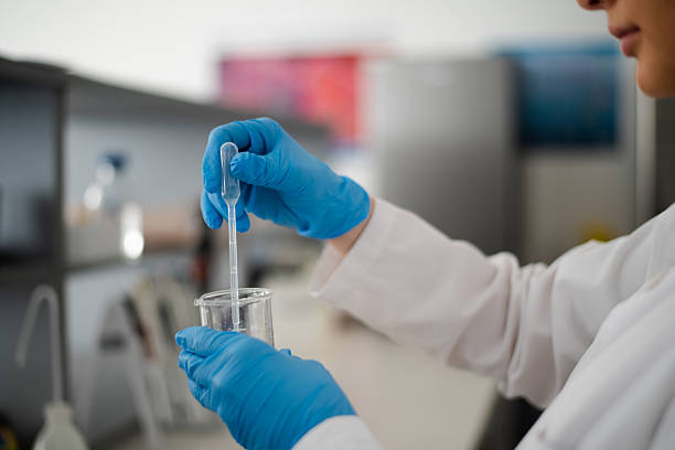 Lab technician scientist makes chemical analysis
