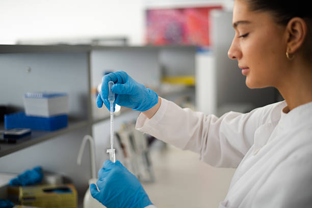 istock Close up, research and hands with pipette 2214510058