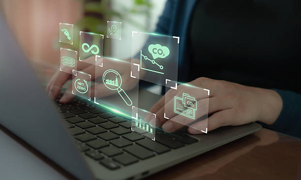 istock MRV System for Carbon Emissions Monitoring Concept. Using a laptop with digital icons representing digital tools used in Measurement, Reporting and Verification (MRV) for environmental monitoring. 2214513886