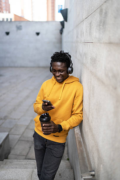 istock Young sportsman checking his smartphone after training 2214513961