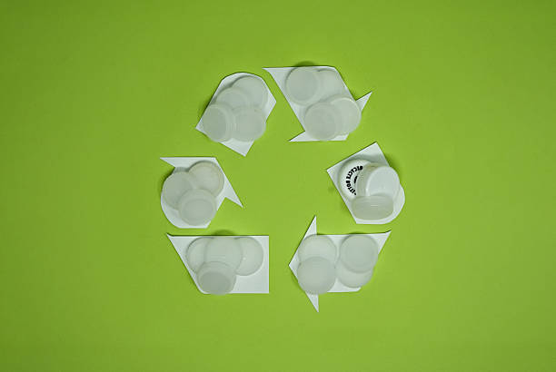 istock White Bottle Caps In Recycling Icon Design 2214515386
