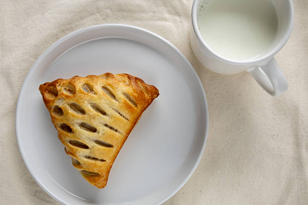 istock Baked puff pastry with milk breakfast setup 2214515653