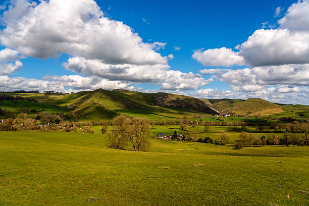 istock Sheep-dotted Ilam pasture unfolding beneath rolling limestone hills and a tapestry of drifting cumulus under a vivid Peak District sky 2214518605